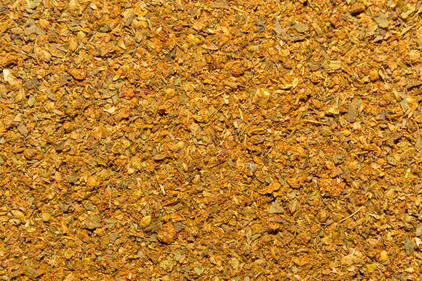 Foto de close up textura de especiarias de laranja para carne e frango, fundo — Fotografia de Stock