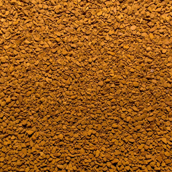 Foto di primo piano texture di marrone macinato caffè istantaneo, sfondo — Foto Stock