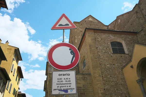 Florence,Italy-July 26, 2018: Road sign of uneven road and restricted vehicle, Florence