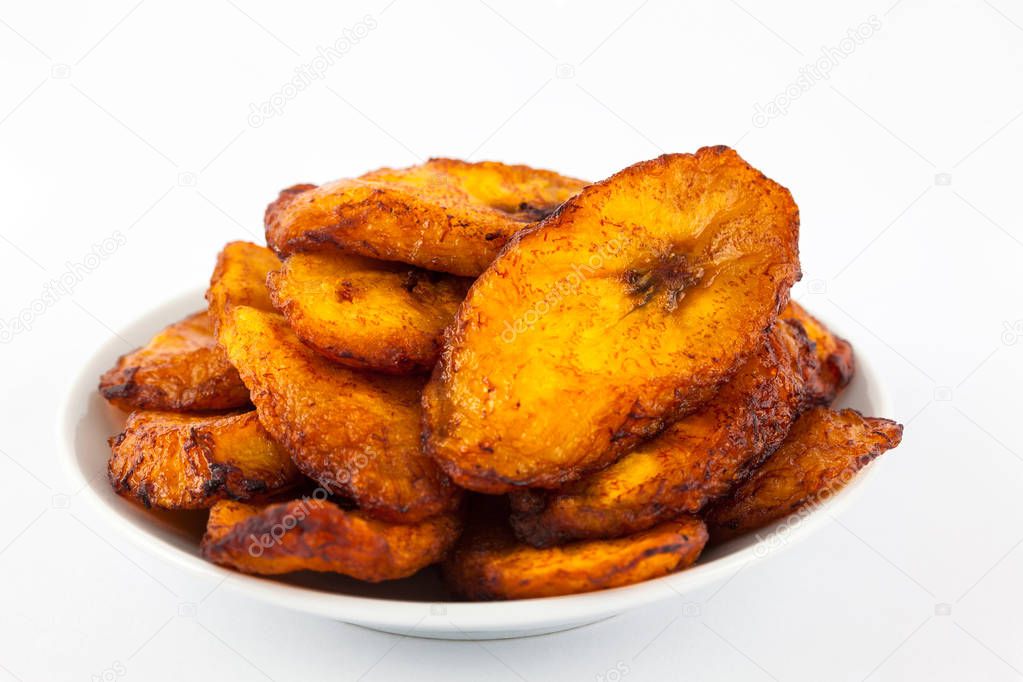 Deep fried ripe plantain slices isolated in white background