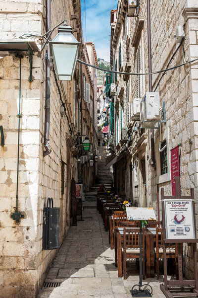 DUBROVNIK, CROATIA - APRIL, 2018: The beautiful steep alleys at the walled old town of Dubrovnik