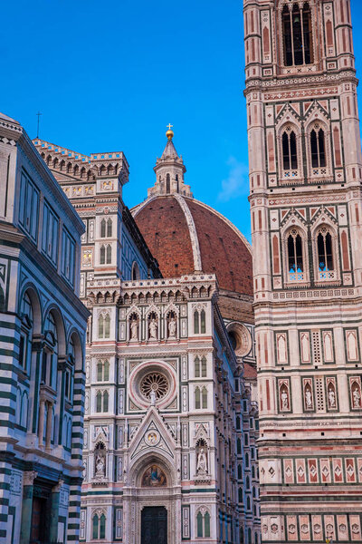 The dusk falls over the Baptistery of St. John, Giotto Campanile and Florence Cathedral consecrated in 1436