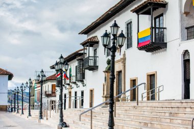 Beautiful streets and houses around Bolivar Square in Tunja city clipart