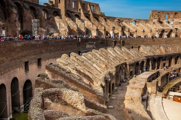 Tourists visiting the Interior of the famous Colosseum in Rome — Stock Photo, Image