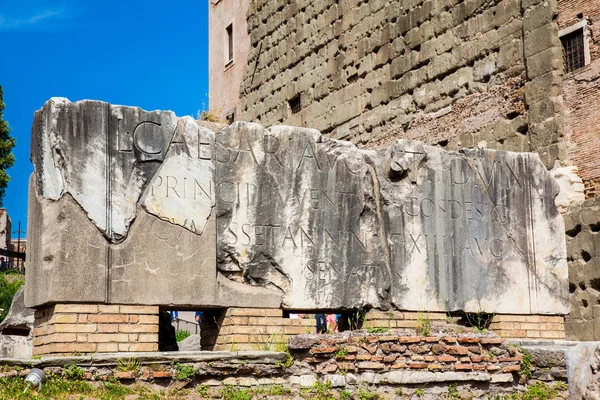Ancient stone inscriptions at the entrance to the Basilica Aemilia at the Roman Forum in Rome