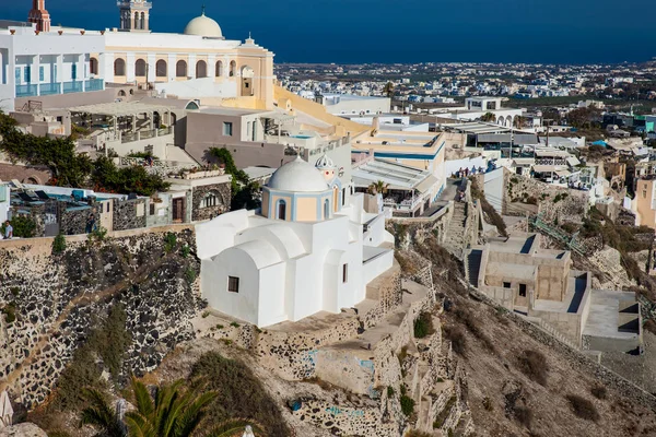 The city of Fira the Catholic Church of St. Stylianos and the Aegean sea in Santorini Island — Stock Photo, Image