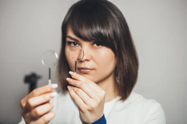 ophthalmologist holds lenses in his hands to check his vision. vision correction in clinic.