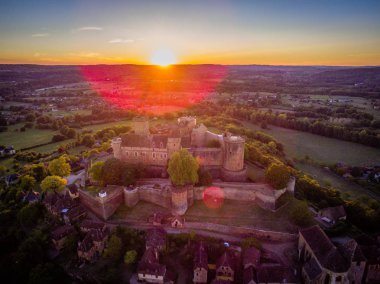 Prudhomat Castelnau castle at sunset in the summer in France clipart