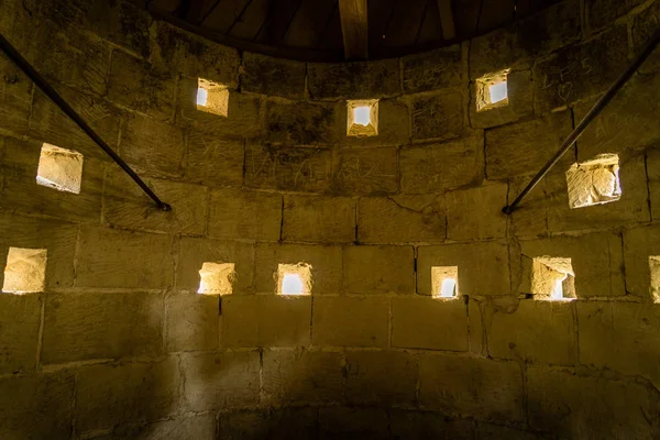 Loopholes in an old medieval shooting tower in France — Stock Photo, Image