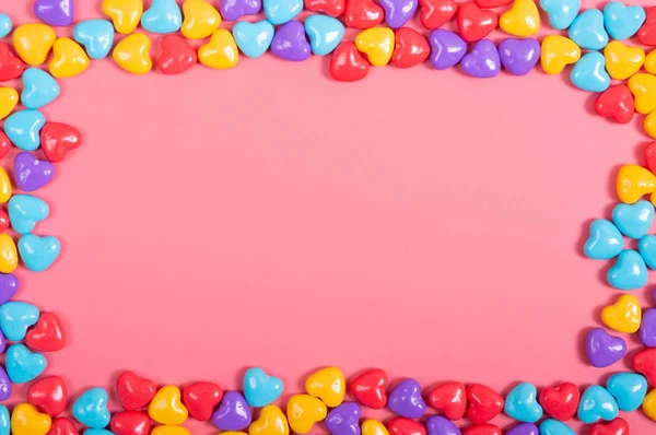 Cukierki na różowym tle — Zdjęcie stockowe