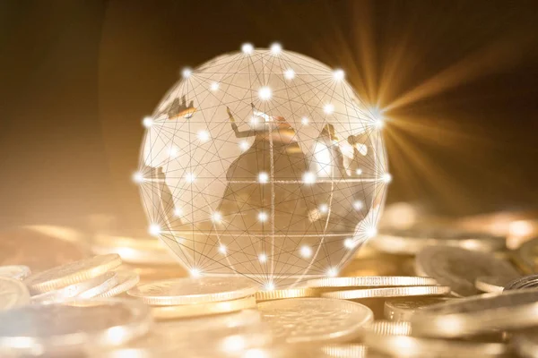 Closed up of world ball with stroke path and connection points put on internation coins. business concept.