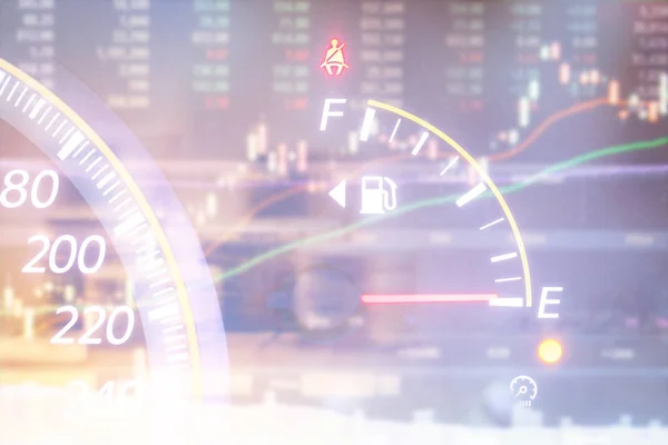 Double exposure of low fuel gauge indicator is warning with blurry stock chart background. Energy business concept.