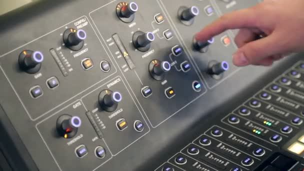 Sound control for the Directors work. The hand of riser adjusts the settings of the audio panel — Stock Video