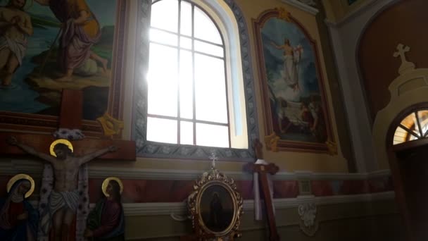 Sun light passes through the stained glass windows of the church. Blick sun stained-glass windows in the old church. — Stock Video