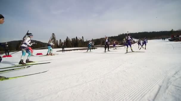 Ukraine. Yavoriv. 12 march 2019. Biathlon competitions in the winter mountains. A group of girls skiers, overcomes the distance. — Stock Video