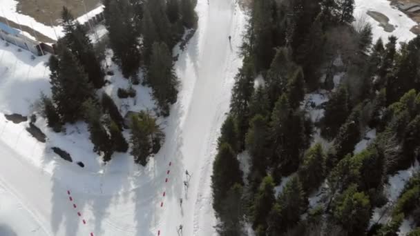 Aerial view Biathlon. Athletes students participating in local competitions. Passage of distance group of athletes in the mountains. — Stock Video