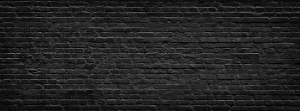 Black brick wall panorama. — Stock Photo, Image