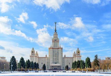 Moscow State University in winter front view. clipart