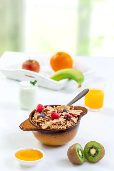 Healthy breakfast with bowl of cereal, orange juice, milk, , and fruits on white background. — Stock Photo, Image