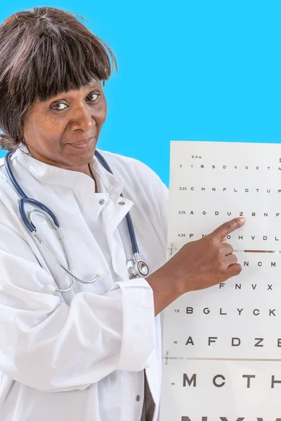 Ophthalmologist checking patient eyesight, pointing letters, eyes examination at office