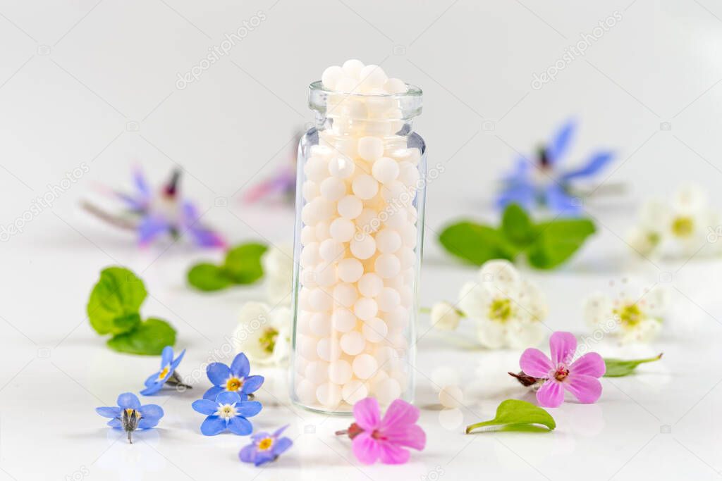Homeopathy. Herbal extracts in small bottles. Selective focus. nature.