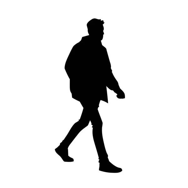 Jovem de casaco, jeans e ténis a andar. Silhueta preta isolada sobre fundo branco. Vista lateral. Ilustração vetorial monocromática do homem dando um passeio. Conceito — Vetor de Stock