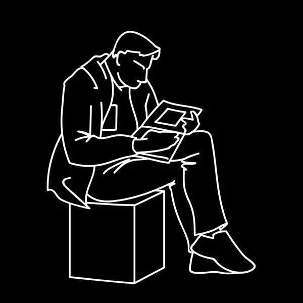 An adult man is reading a book sitting on a cube. Vector illustration of a man gazing intently into a magazine or journal with square art. Sketch. Linear art. White lines isolated on black background. — Stock Vector