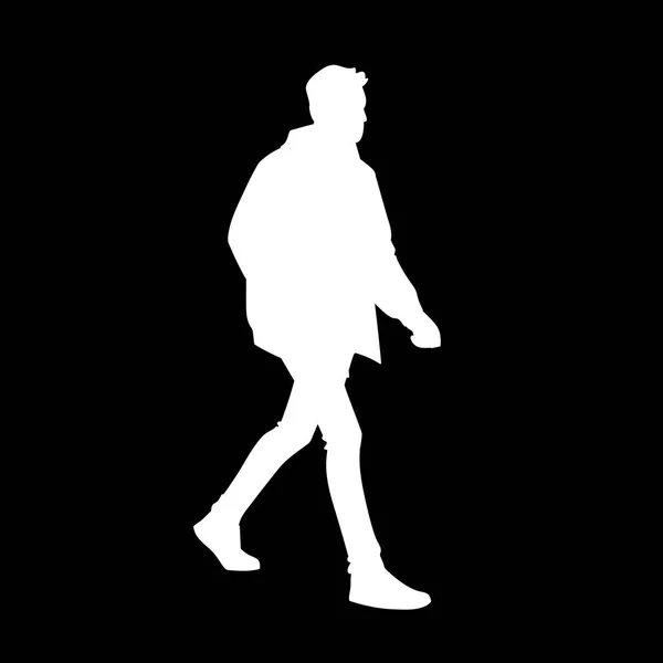 Hombre joven con chaqueta, jeans y zapatillas de deporte caminando. Silueta blanca aislada sobre fondo negro. Vista lateral. Ilustración vectorial monocromática del hombre dando un paseo. Concepto . — Vector de stock