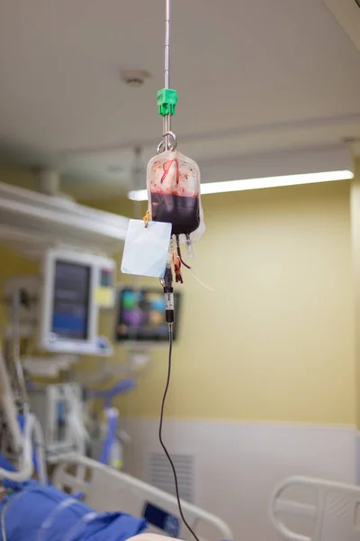 Blood bag with blood almost running out to patient.