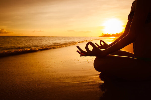 Peaceful sunset meditation at the beach