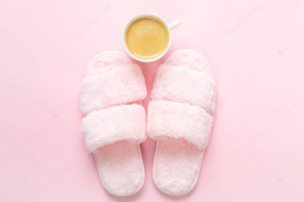 Composition of faux fur slippers and healthy breakfast on a light pink background. Morning concept. Flat Lay. Top View