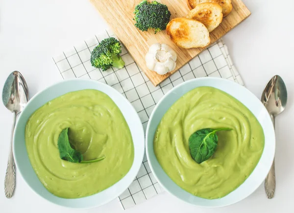 Broccoli cream soup in pastel blue plate on white background. Healthy food concept — Stock Image Broccoli Cream Soup Pastel Blue Plate White Background Healthy Food Royalty Free Stock Images