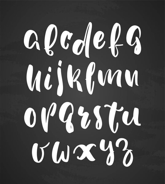 Hand Drawn English modern brush type alphabet letters on blackboard background.