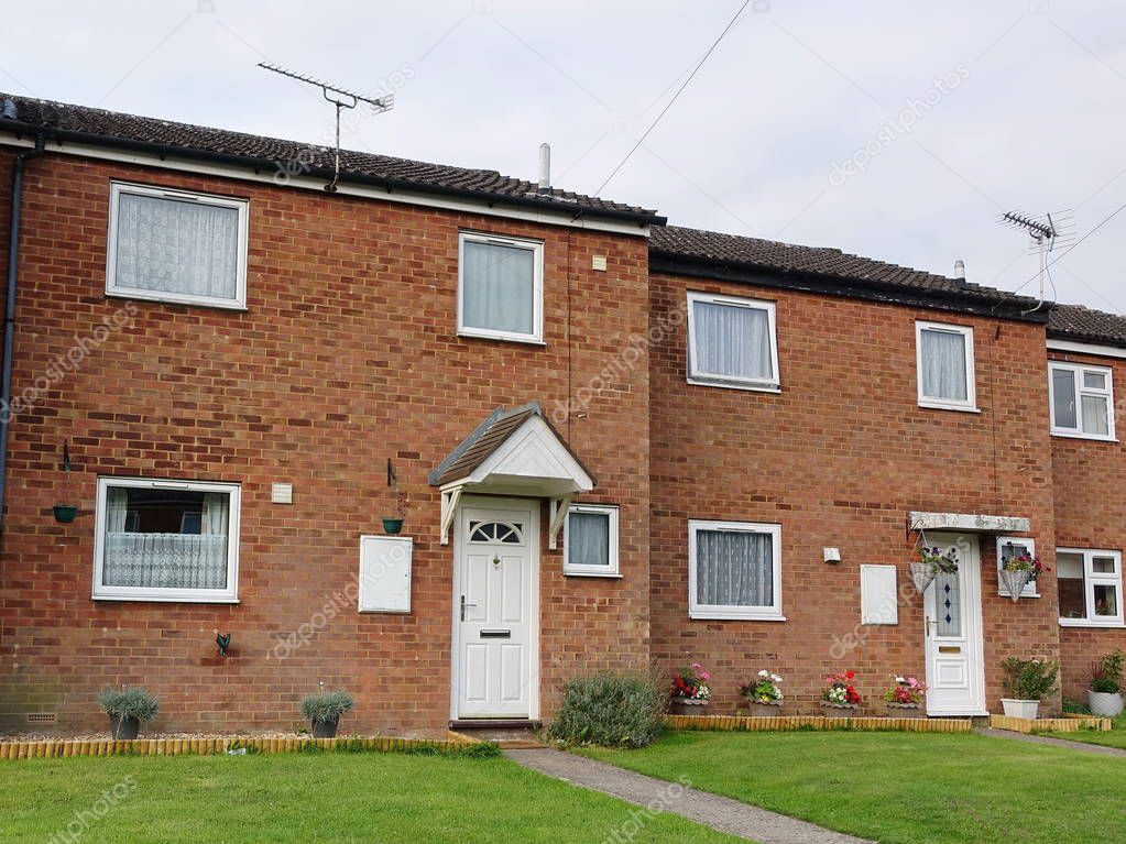 Exterior View of Terraced Red Brick Houses on Typical English Residential Estate