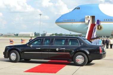 BANGKOK - NOV 18: the unidentified bodyguards waiting by the Presidential State Car and Air Force One at an airport as President Barack Obama begins a SE Asia tour on Nov 18, 2012 in Bangkok, Thailand.