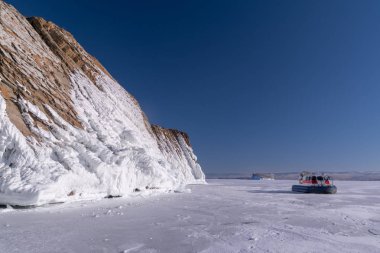 Hovercraft on the ice of Lake Baikal clipart