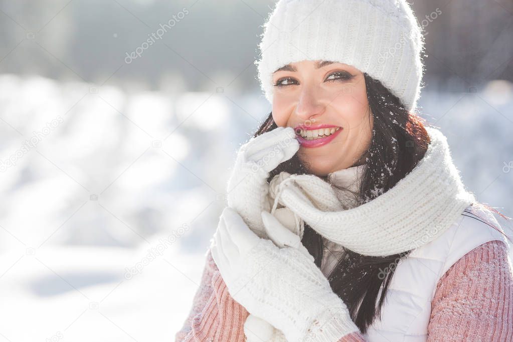 Close up portrait of young beautiful woman in winter time