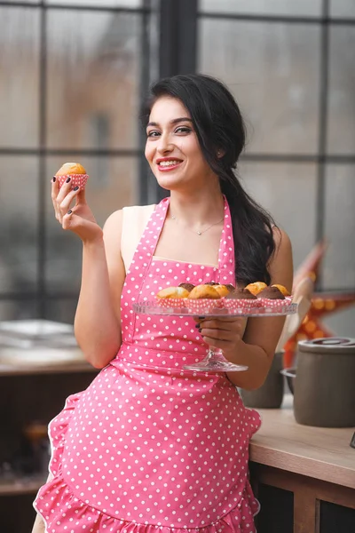 Young attractive woman baking in kitchen at home