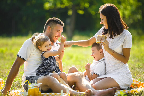 Happy family on picnic at park