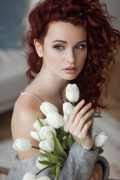 Very attractive young woman close up portrait. Beautiful female indoor. Curly haired lady. Red-haired girl. Redhead with wavy hair.