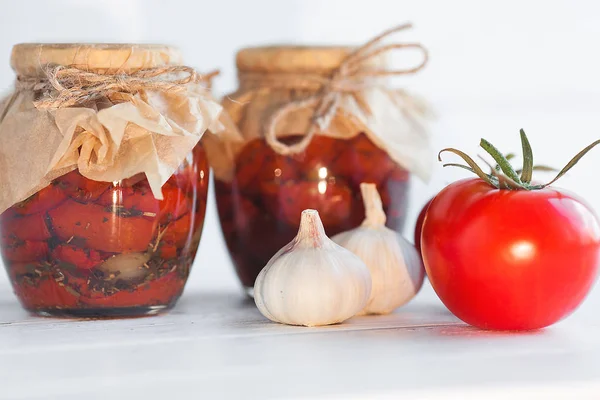 Tomatoes in the jar. Homemade sun dried tomatoes. temporary closing-down. Summer and autumn canned food. conserve with spices and vegetables.