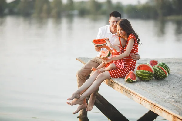 Happy Young Family Sitting Water Bridge Mom Dad Little Baby — Stock Photo, Image