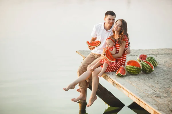 Happy Young Family Sitting Water Bridge Mom Dad Little Baby — Stock Photo, Image