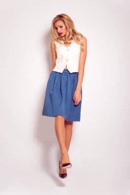  Beauty stylish blonde woman posing in fashionable clothes in studio