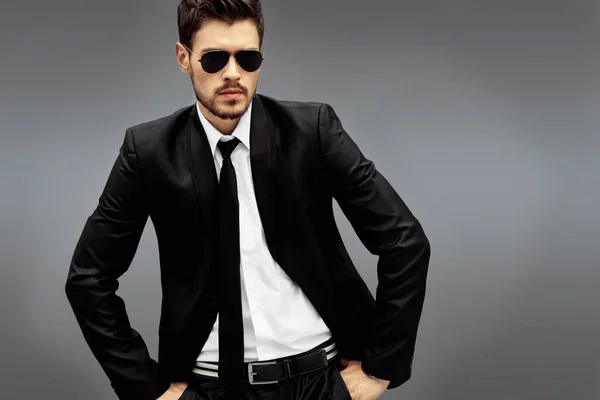 Stylish Man Sunglasses Black Suit Grey Background — Stock Photo, Image