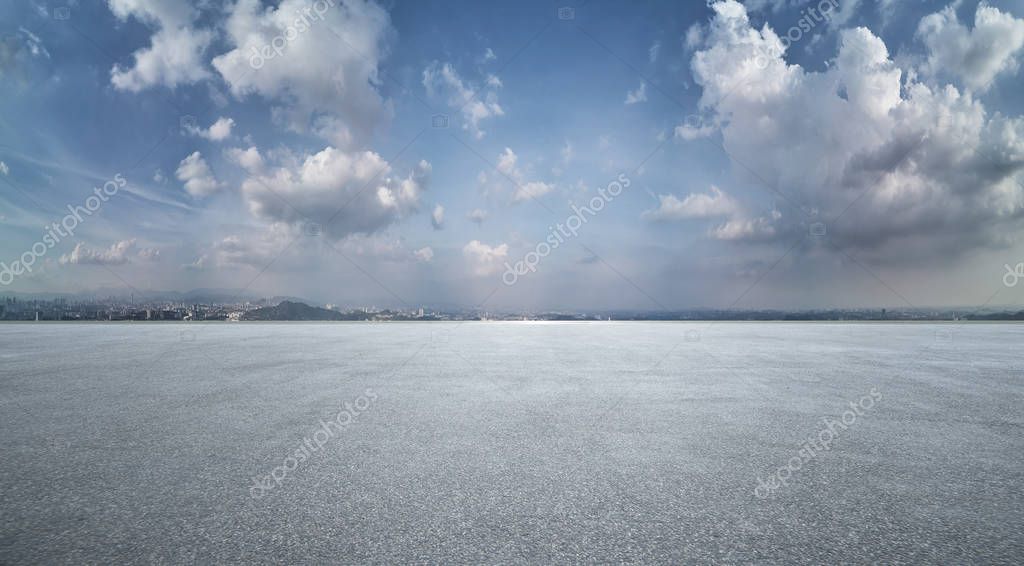 Panorama big field  view of asphalt road and dramatic sky landscape .