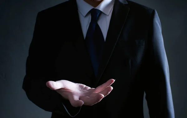 Businessman Black Suit Lending Helping Hand Isolated White Background — Stock Photo, Image