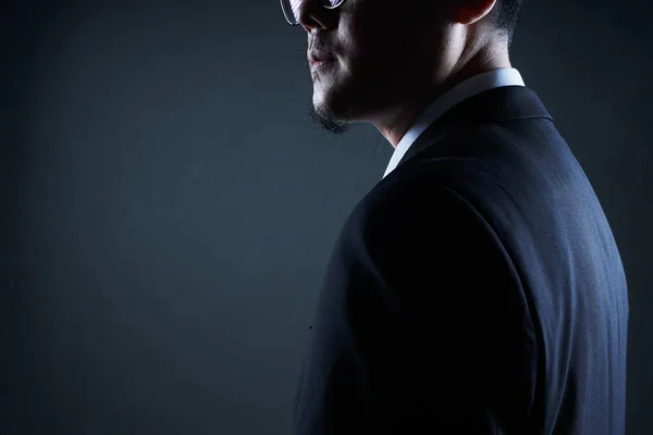 Closeup Three Quarter Rear View Businessman Black Background — Stock Photo, Image