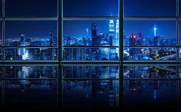Modern empty and clean office interior with glass windows and city skyline background, night scene