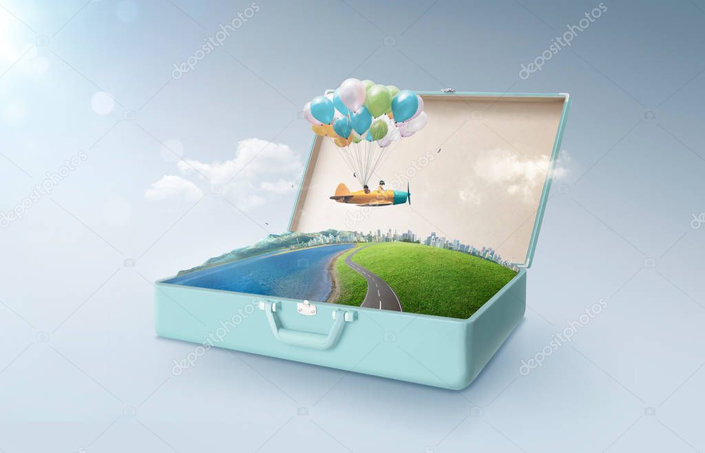 Happy sister enjoy with fantasy colorful balloons plane fly and floating in an open retro vintage suitcase isolated on light blue background . Travel and vacation concept.